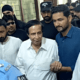 Parvez Elahi leaving the Islamabad High Court, the fleeting taste of freedom palpable but elusive. A white SUV in the background stands as an ominous symbol of the saga to come.
